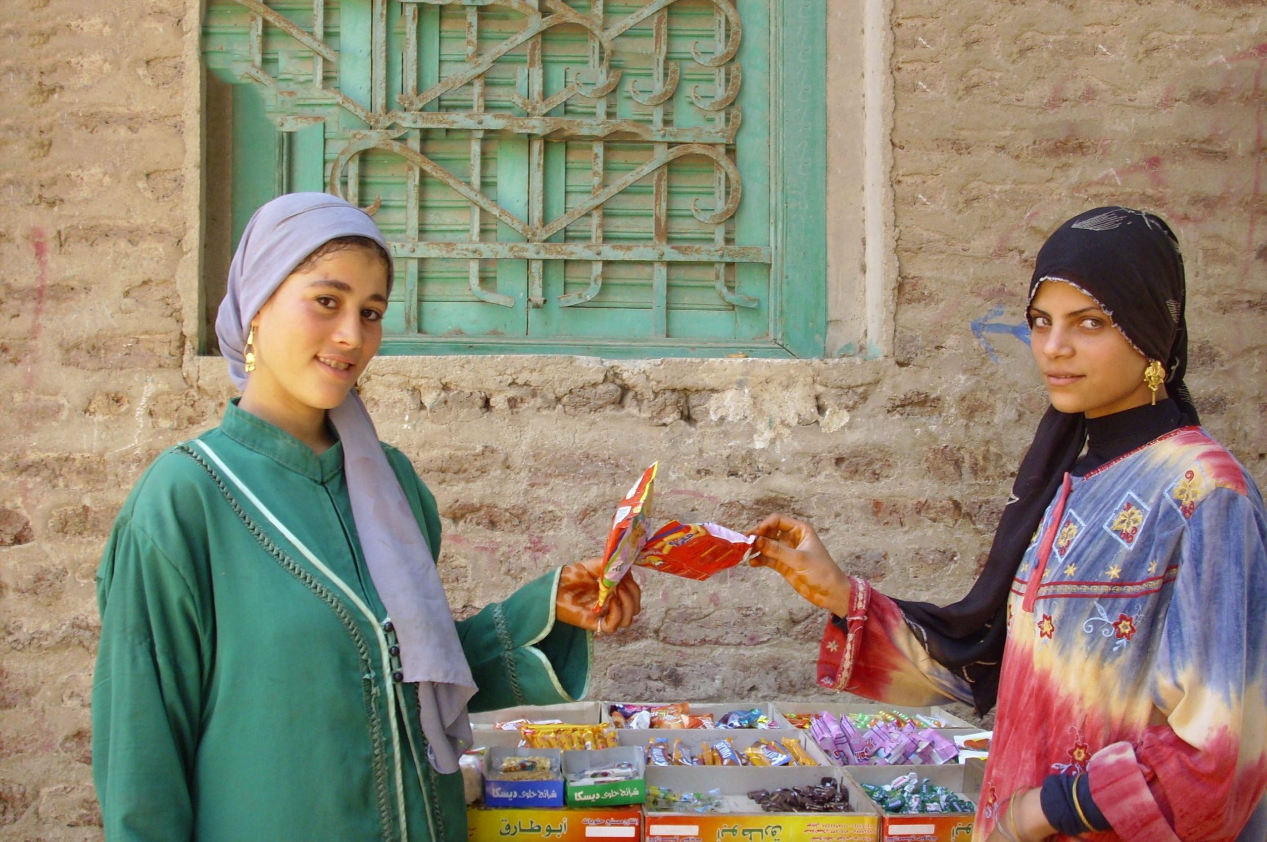 Two women selling candy